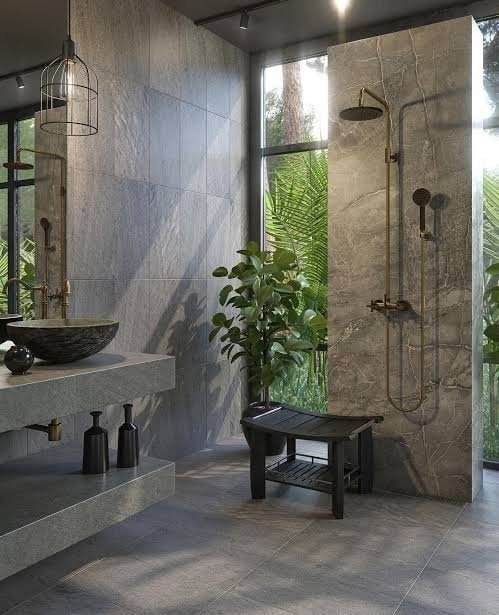 Bathroom remodel with stone tile, vessel sink and rain shower in Concord, CA