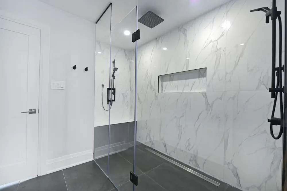 Glass walk-in shower with mar